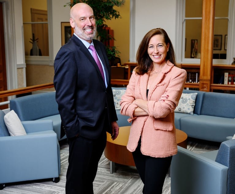 R. Cameron Garrison, left, managing partner of Lathrop GPM, and Jennifer Johnson, right, managing shareholder of Hopkins Carley.